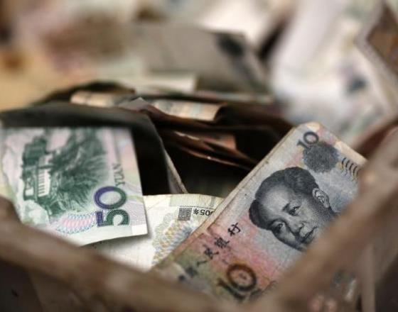 China's yuan edges up on 15-month high midpoint