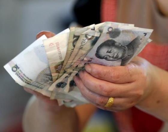 China's yuan firms as central bank keeps pressure on speculators