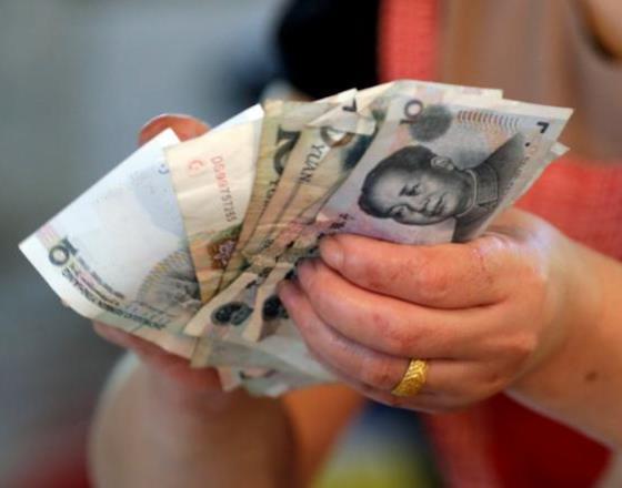 China's yuan trade system to open branches in London, New York