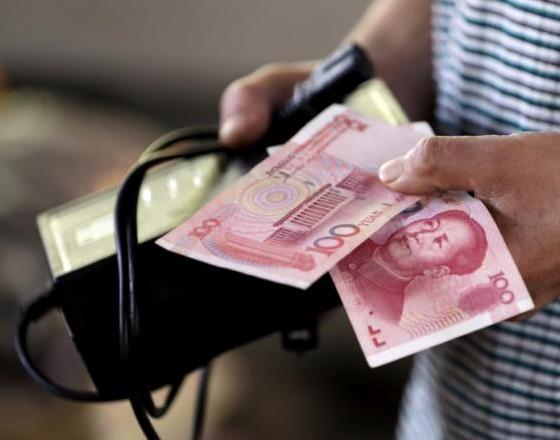 China's yuan firms as dollar slumps globally